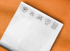 Quais os significados dos símbolos nas etiquetas dos tecidos?